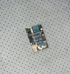 THE MYSTERIOUS BAKERY ON RUE DE PARIS by Evie Woods