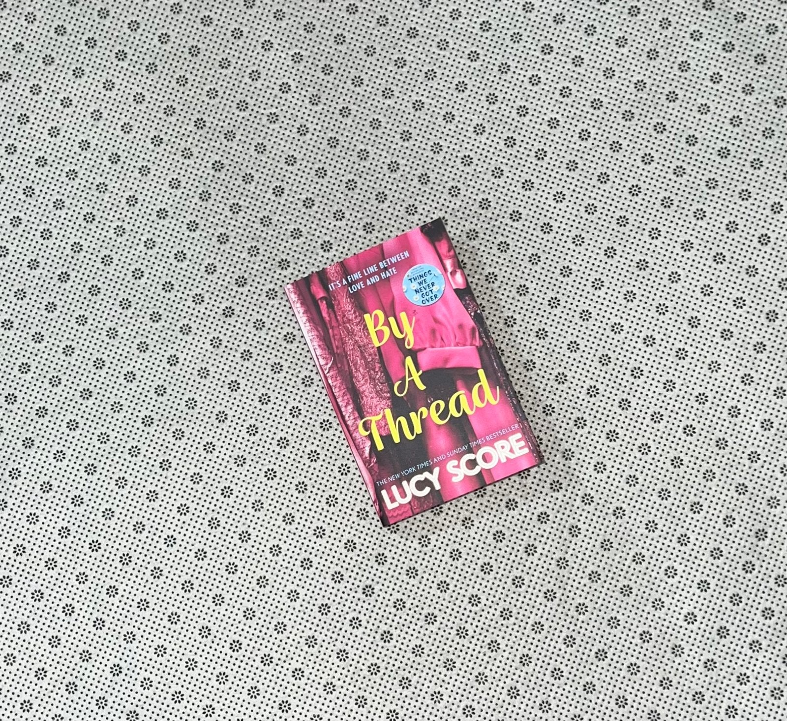 by a thread by lucy score