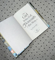 the girl who fell beneath the sea dust jacket edition by axie oh