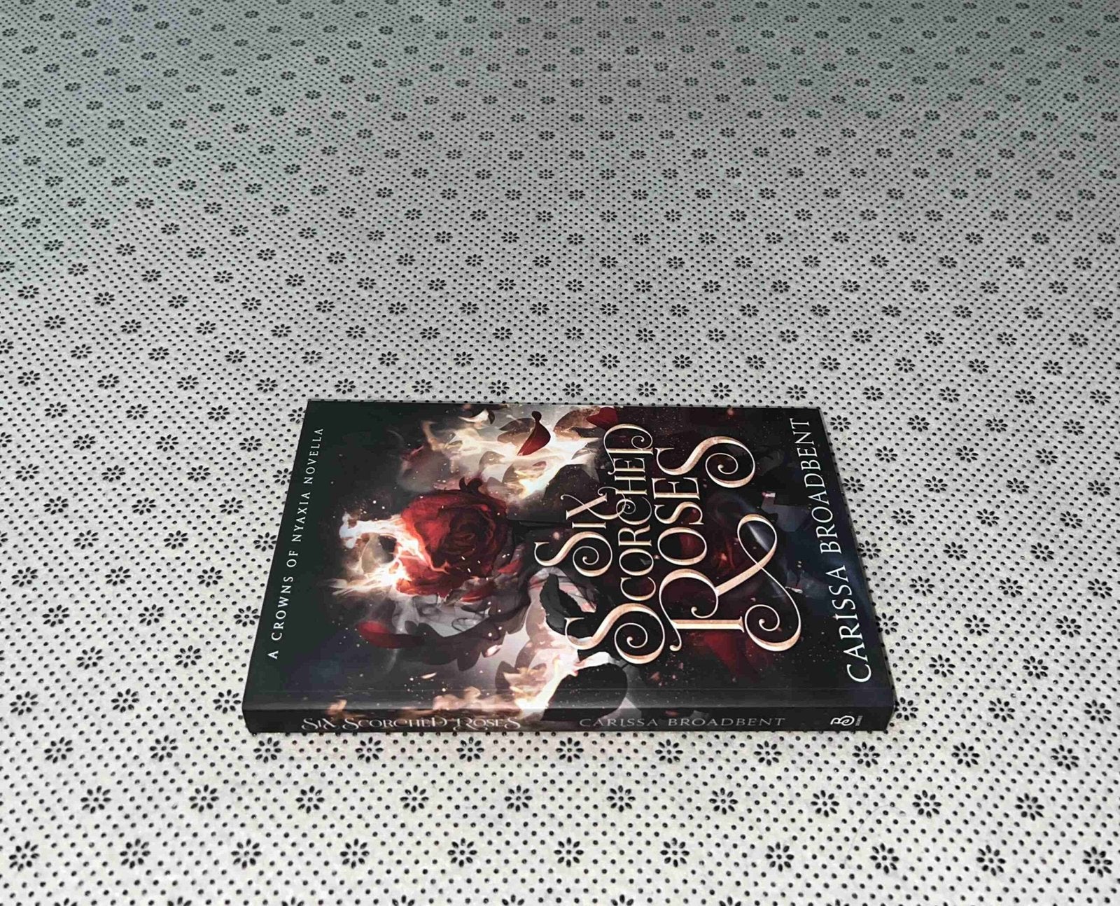 six scorched roses a crowns of nyaxia short novel by carissa broadbent