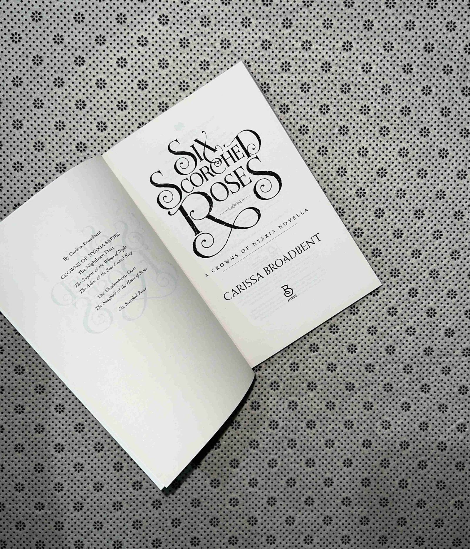 six scorched roses a crowns of nyaxia short novel by carissa broadbent